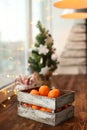 Christmas decoration. Christmas cooking. Dough, flour, cookies, tangerines, cup, mug, christmas ligths. box with fruit, opels on Royalty Free Stock Photo