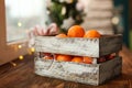 Christmas decoration. Christmas cooking. Dough, flour, cookies, tangerines, cup, mug, christmas ligths. box with fruit, opels on Royalty Free Stock Photo