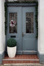 Christmas decoration of the door with a beautiful traditional wreath Royalty Free Stock Photo