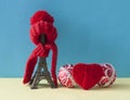 Christmas decoration with eiffel tower statue in red scraf and hat on colorful paper background. Holiday background with copy