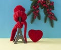 Christmas decoration with eiffel tower statue in red scraf and hat on colorful paper background. Holiday background with copy