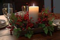 Christmas decoration of the festive table with a candle. Generative AI Royalty Free Stock Photo