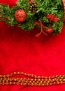 Christmas decoration fir branch on red Royalty Free Stock Photo