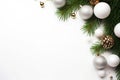 Christmas decoration with fir branches and baubles on a white background with copy space. AI generated Royalty Free Stock Photo
