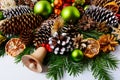 Christmas decoration with fir branches, pine cones and dried ora Royalty Free Stock Photo