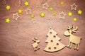 Christmas decoration with fir and deer. Wooden background. Royalty Free Stock Photo