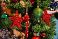Christmas decoration on fir, red star hanging like decoration on Royalty Free Stock Photo
