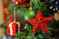 Christmas decoration on fir, red star hanging like decoration on Royalty Free Stock Photo