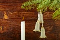 Christmas decoration. Fir-tree, bells and candle Royalty Free Stock Photo