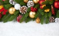 Christmas decoration on fir tree branch closeup, gifts, xmas ball, cone and other object on white blank space fur, holiday concept Royalty Free Stock Photo