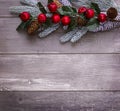 Christmas decoration of fir tree and conifer cone on textured wood background Royalty Free Stock Photo