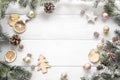 Christmas decoration of fir tree and conifer cone on wood background, top view. Copy space Royalty Free Stock Photo
