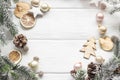 Christmas decoration of fir tree and conifer cone on wood background, top view. Copy space. Royalty Free Stock Photo