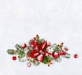 Christmas decoration. Flower of red poinsettia, twigs christmas tree, christmas red balls, cones pine and red berries covered snow Royalty Free Stock Photo