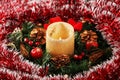 Christmas decoration in the form of a candle and a wreath Royalty Free Stock Photo