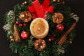 Christmas decoration in the form of a candle and a wreath Royalty Free Stock Photo