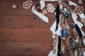 Christmas decoration of fur decorative Christmas tree, Christmas decorations, biscuits and ribbon on brown background