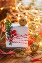 Christmas Decoration gift box and gold jingle bells with branch fir and sparkle. Holiday greeting card Royalty Free Stock Photo