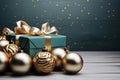 Christmas decoration with gift box and golden baubles on wooden table Royalty Free Stock Photo