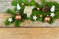 Christmas decoration with gift box, ornaments and fir branch on rustic wood background Royalty Free Stock Photo