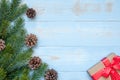 Christmas decoration, gift box and pine tree branches on wooden background, preparation for holiday concept, Happy New Year and Xm Royalty Free Stock Photo