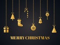Christmas decoration. Gold ornaments isolated on dark background. Bright hanging christmas toys, tree, gift boxes Royalty Free Stock Photo