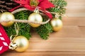 Christmas decoration - golden baubles, poinsettia, fir branches and cones Royalty Free Stock Photo