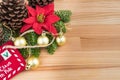 Christmas decoration - golden baubles, poinsettia, fir branches and cones Royalty Free Stock Photo