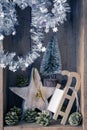 Christmas decoration golden bell jar, sledge, star and tree in a Royalty Free Stock Photo