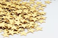 Christmas decoration of golden confetti stars against