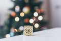 christmas decoration, golden gift and defocused lights background Royalty Free Stock Photo