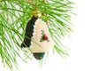 Christmas decoration handbell on the fir-branch isolated