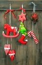 christmas decoration handmade toys hanging over wooden background Royalty Free Stock Photo