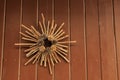 Christmas decoration hanging on exterior door with pine cones and wooden sticks. Christmas concept