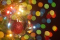 Christmas decoration. Hanging red balls on pine branches christmas tree garland and ornaments over abstract bokeh background with Royalty Free Stock Photo