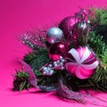 Christmas Decoration. Hot Pink and Silver Balls on Christmas tree branch over magenta background. Holiday Card Royalty Free Stock Photo