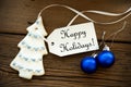 Christmas Decoration with a Label with Happy Holidays Royalty Free Stock Photo