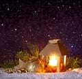 Christmas lantern on white snow.Winter night background. Royalty Free Stock Photo