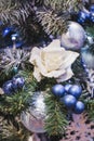 Christmas decoration with a lot small blue balls and decorative white rose Royalty Free Stock Photo