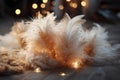 A Christmas decoration made of feathers laying on a wooden table illuminated by golden sparks