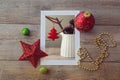 Christmas decoration photo on wooden table with ornaments. View from above