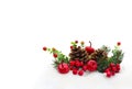 Christmas decoration. Pine natural cones, twigs christmas tree, red berries and red apples on snow with space for text Royalty Free Stock Photo