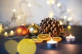 Christmas decoration, pinecone with christmas balls and candels