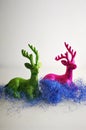 Multicolored sparkling reindeers