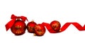 Christmas decoration red balls with ribbon isolated on a white Royalty Free Stock Photo