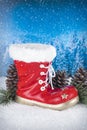 Christmas decoration with red boot and pines on a background wit Royalty Free Stock Photo