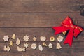 christmas decoration and red bow on wood background with copyspace. Royalty Free Stock Photo