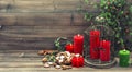 Christmas decoration with red candles and cinnamon cookies Royalty Free Stock Photo