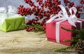 Christmas decoration of red gift box and red winterberry Royalty Free Stock Photo