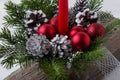 Christmas decoration with red ornaments and silver pine cones Royalty Free Stock Photo